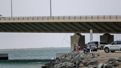 Hazy weather and high temperatures are expected. Victor Besa/The National