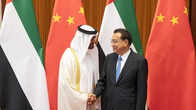 Sheikh Mohamed bin Zayed stands for a photograph with Chinese Premier Li Keqiang at the Great Hall of the People in Beijing. Ministry of Presidential Affairs
