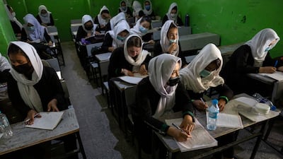 Gordon Brown believes G7 countries should aid Afghan female students like those in 10th grade class at the Zarghoona high school, Kabul. Getty