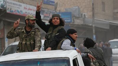 Turkey-backed opposition fighters of the Free Syrian Army patrol the northwestern city of Afrin. Lefteris Pitarakis / AP
