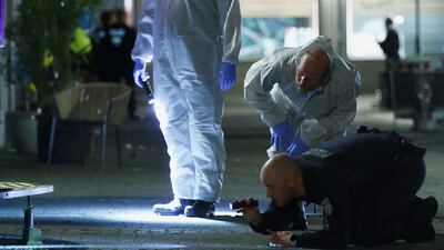 Police and forensic experts working at the scene after a knifeman killed three people and injured eight others at a festival in Solingen, western Germany. Reuters