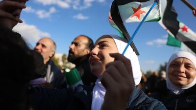 People gather to celebrate the opposition takeover of Damascus, following the Friday prayers, at Umayyad Square in Damascus, Syria earlier this month. EPA