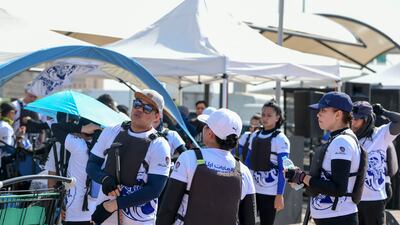 Team members gather at designated tents during the Hong Kong Dragon Boat Festival 2022 at the Waterfront Market in Deira. All photos: Khushnum Bhandari / The National