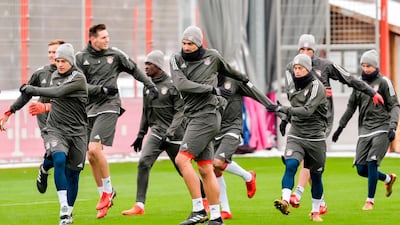 Bayern Munich's players go through their paces during a training session ahead of the Uefa Champions League match against Paris Saint-Germain. Gunter Sciffmann / AFP