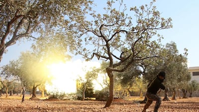 A rebel fighter from Jaish Al Fatah fires mortar shells towards government-controlled districts of Aleppo from the southwestern frontline neighbourhood of Dahiyet Al Assad on October 30, 2016 Omar Haj Kadour/AFP