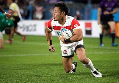 Japan's Kenki Fukuoka reacts after scoring a try during the Rugby World Cup in his home country. Global sports events such as this and the 2020 Olympic could prop up Japan's flagging economy and attract investor interest. AP
