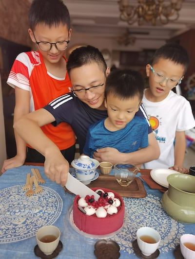 Dr Huafei Li cuts his birthday cake with his sons during his China visit last year. Photo: Dr Huafei Li
