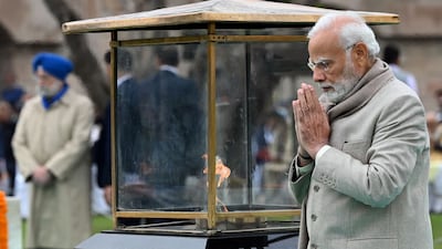 India's Prime Minister Narendra Modi pays his respects at the Gandhi memorial in New Delhi. AFP