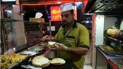 Mohammed Saeed Abdul from Egypt makes chicken shawarma at the Foul wa Felafel restaurant in Sharjah.