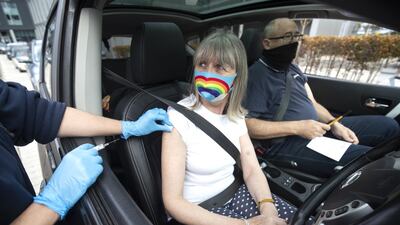 A woman receives a flu vaccine at a drive-through flu inoculation clinic in Little France, Edinburgh. Getty Images