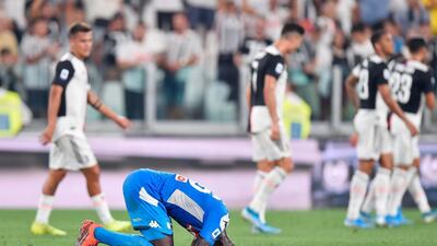 Kalidou Koulibaly sinks to the pitch after his injury time own goal. AP Photo