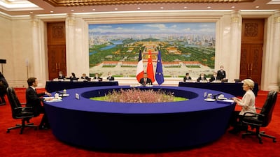 Mr Xi, Mr Macron and European Commission President Ursula von de Leyen during a working session in Beijing. AFP