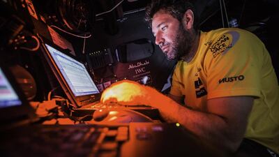 24th October 2014. A weary Simon Fisher feverishly types away in the Nav Station. Leg 1 onboard Abu Dhabi Ocean Racing Azzam. Matt Knighton/Abu Dhabi Ocean Racing/Volvo Ocean Race