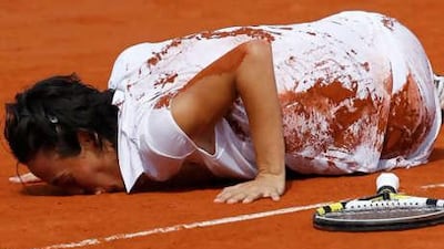 Francesca Schiavone kisses the clay in celebration following her win over Samantha Stosur in the French Open final.