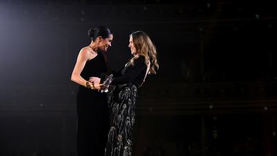 The Duchess of Sussex and Givenchy designer Clare Waight Keller on stage.