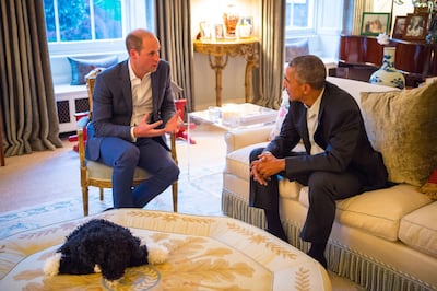 Prince William, Duke of Cambridge speaks with former US president Barack Obama in the Drawing Room of Apartment 1A Kensington Palace on April 22, 2016. Getty Images