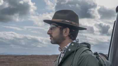 Sheikh Hamdan wore a green waterproof jacket paired with a checked shirt underneath, with protective eyewear and a Stetson hat
