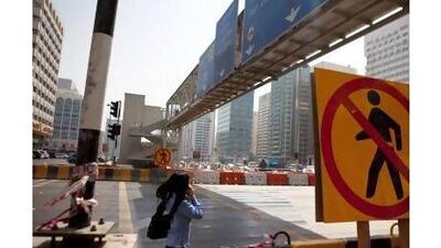 A reader calls for the lifts on the pedestrian bridge outside Abu Dhabi Mall to be fixed. Silvia Razgova / The National