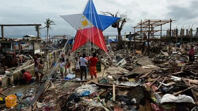 Typhoon Haiyan survivors have built a giant lantern amid the debris from destroyed houses in the coastal area of Tacloban, Leyte province, the Philippines. Ted Aljibe / AFP