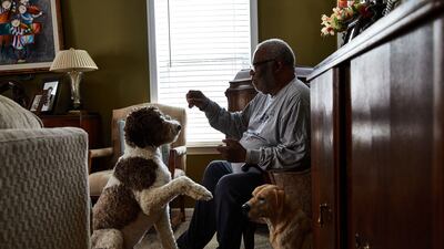 Brian van Buren, a 71-year-old retired flight attendant living with Alzheimer's since 2015, at home with his two dogs in Charlotte, North Carolina, in March. Bloomberg