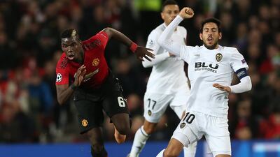 Manchester United's Paul Pogba in action wth Valencia's Daniel Parejo. EPA