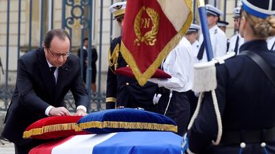 French president Francois Hollande awards posthumously the Legion d’Honneur at a ceremony in Versailles, near Paris, for one of the police officers killed by an alleged ISIL attack. Dominique Faget / AP Photo