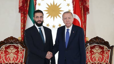 Turkish President Recep Tayyip Erdogan, right, shakes hands with Syrian President Ahmad Al Shara during their meeting in Istanbul. AFP