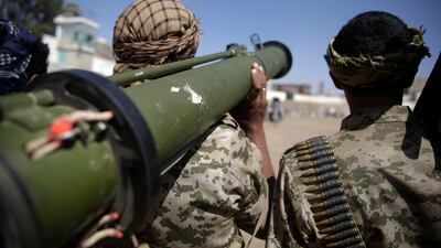 A Houthi rebel fighter holds his a weapon during a gathering aimed at mobilising more fighters for the Iranian-backed Houthi movement, in Sanaa, Yemen. AP