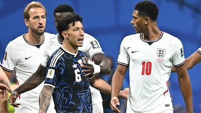 Argentina's defender Lisandro Martinez argues with Jude Bellingham of England. AFP