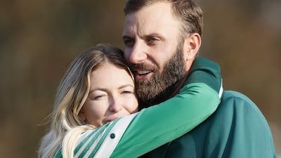 Dustin Johnson of the US is embraced by his fiancee Paulina Gretzky after winning the 2020 Masters at the Augusta National Golf Club in Augusta, Georgia. EPA