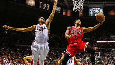 How far the Chicago Bulls go in the NBA play-offs depends on which Derrick Rose, right, shows up - the dominating force or the mis-firing guard. Maury Tannen / EPA