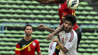 Timor Leste player Diogo Santos Rangel (top) in action against UAE’s Amer Abdulrahman (down) during the FIFA World Cup 2018 preliminary qualification match between the UAE and Timor Leste at Shah Alam Stadium outside Kuala Lumpur, Malaysia, 16 June 2015. EPA/STR