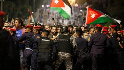 Police officers secure the office of Jordan's prime minister in Amman. Muhammad Hamed / Reuters