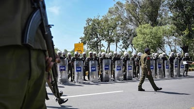 Riot policemen line up along a road near the expected venue of the US-Iran talks in the Red Zone area of Islamabad. AFP