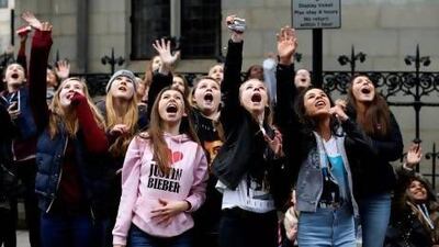 Fans scream as Justin Bieber appears at the window of a hotel in central London last month. Reuters