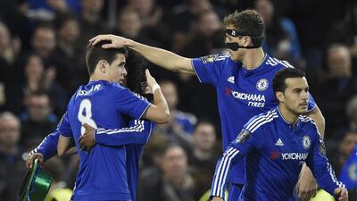 Chelsea players celebrate with Oscar, left, after his goal on Saturday against Sunderland in the Premier League. Peter Powell / EPA / December 19, 2015