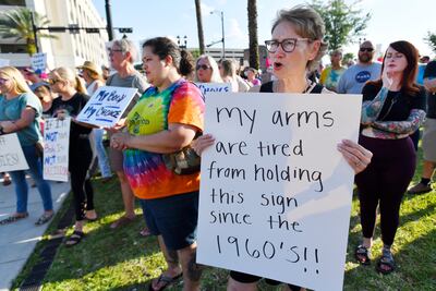 Pamela Nelson holds a sign in front of the Duval County Courthouse in Jacksonville, Florida. Protesters voiced their opinions after a draft opinion suggests the US Supreme Court could be poised to overturn the landmark 1973 Roe v Wade case that legalised abortion nationwide. AP
