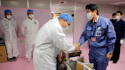 He reassumed office on December 26, 2012. This file photo taken on December 29, 2012 shows Mr Abe greeting workers at the Tokyo Electric Power Company's (TEPCO) emergency operation centre inside the crippled Fukushima Daiichi nuclear power plant in Ota. AFP