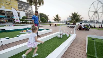 Families enjoy the weather and the view of BlueWaters from The Beach, Jumeirah Beach Residence, Dubai. Leslie Pableo for The National