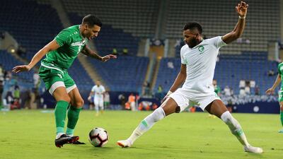 Saudi Arabia's Ali Albulhy, right, in action against Iraq's Ahmed Yassin in Riyadh, Saudi Arabia. The match at the King Saud University Stadium finished 1-1. EPA