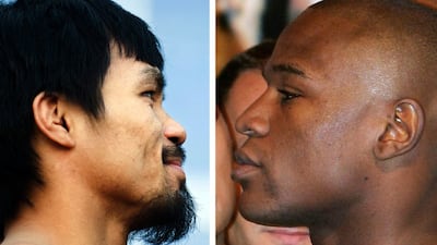 Unbeaten fighter Floyd Mayweather, right, said February 15, 2015 that neither he nor Manny Pacquiao have signed a deal for a May mega-fight, but he still hopes to get into the ring with the Filipino icon. AFP PHOTO / Chris Cozzone; Robyn BECK / FILES