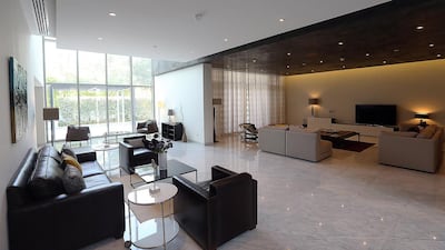 The living room area on the ground floor of a 5-bedroom Contemporary Villa. Buyers can take a pick and mix approach with three design styles of villa on offer - Modern Arabic, Mediterranean and Contemporary - ranging from four to eight bedrooms. Satish Kumar / The National