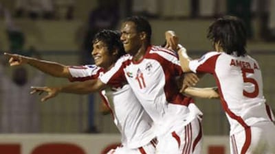 Emirati players, from left to right, Rashed al-Falasi, Ahmed Khalil al-Junaibi and Amir al-Hammadi, celebrate after scoring a goal against Uzbekistan during their AFC U19 Championship final in Dammam on Nov 14 2008.
