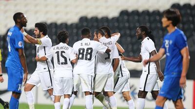 Al Jazira players celebrate their goal in Tuesday night's 1-1 draw with Al Hilal in the Asian Champions League. Adil Al Naimi / Al Ittihad / March 15, 2016
