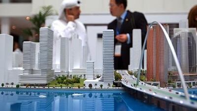Visitors look at a model of the Al Maryah Island project during the Cityscape Abu Dhabi 2013. Ravindranath K / The National