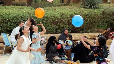Children play outside the King Abdulaziz Mosque in Riyadh, Saudi Arabia. Reuters