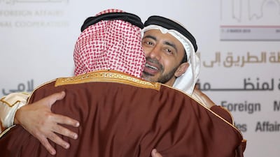 Sheikh Abdullah greets Bahrain's Minister of Foreign Affairs Khalid bin Ahmed Al Khalifa. Chris Whiteoak / The National