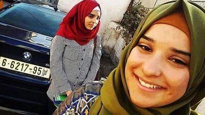 Hadeel Wajih Awwad, 14, left, and Norhan Awwad, 16, in Qalandiya refugee camp. Israel has not released Hadeel’s body and forbidden Norhan’s father from seeing her in hospital. Photo courtesy of Awwad family