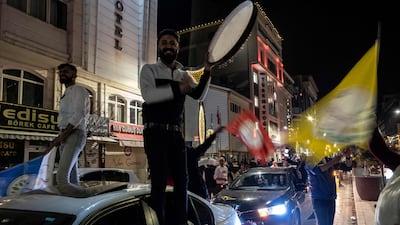 Supporters of the pro-Kurdish DEM party celebrate after officials reinstated municipal election winner Abdullah Zeydan in Van, Turkey. AFP