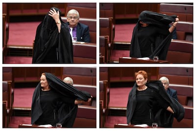 Pauline Hanson wearing a burqa in Parliament House in Canberra, Australia, in 2017 in her bid to get them banned. Lukas Coch / AAP via AP